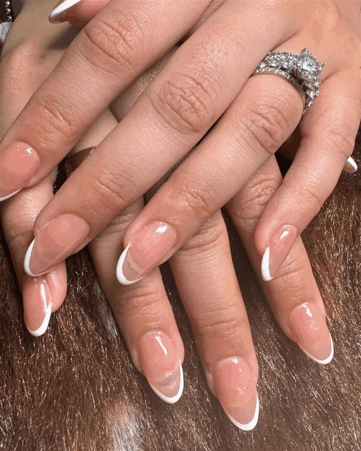 Almond nails with a thin white French tip