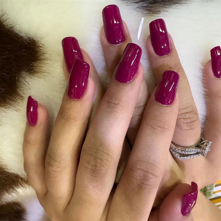 Glossy berry-coloured square nails